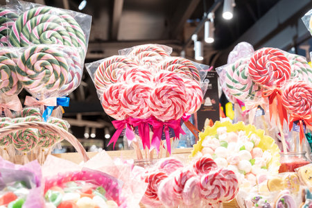 Cane candy, Many striped colorful traditional handmade christmas candies, lollipop, canes, sweets, treats at the counter of a store. Kids love white andの写真素材