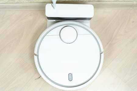 Robot wireless vacuum cleaner working on theの写真素材