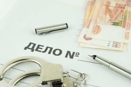 folder and label dealing with handcuffs and money