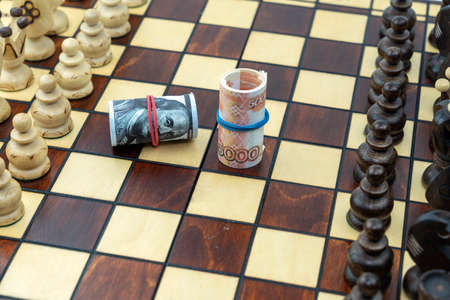 dollars and rubles on the chessboard, the concept ofの写真素材