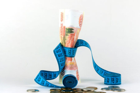 measuring tape and Russian money, the concept of falling exchange rate, the beginning of the