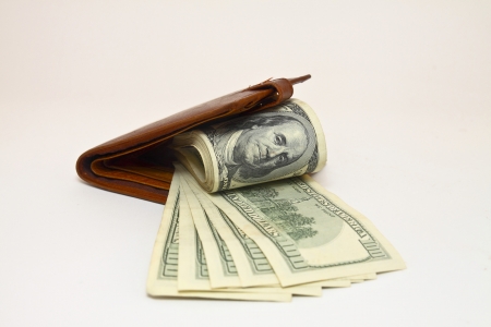 Wallet with dollars on white backgroundの写真素材