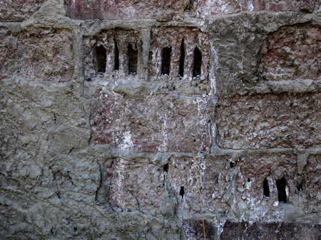 picture of a fragment of an old brick wall for use as a backgroundの写真素材
