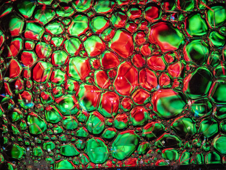 Abstract background, soap foam on the water surface. Beautiful and colorful macro
