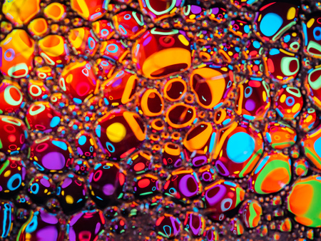 Abstract background, soap foam on the water surface. Beautiful and colorful macroの写真素材