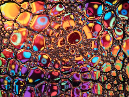 Abstract background, soap foam on the water surface. Beautiful and colorful macroの写真素材