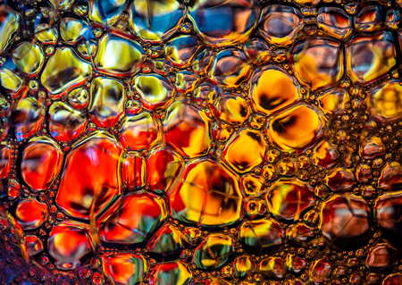 Abstract background, soap foam on the water surface. Beautiful and colorful macroの写真素材