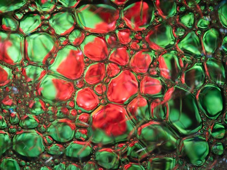 Abstract background, soap foam on the water surface. Beautiful and colorful macroの写真素材