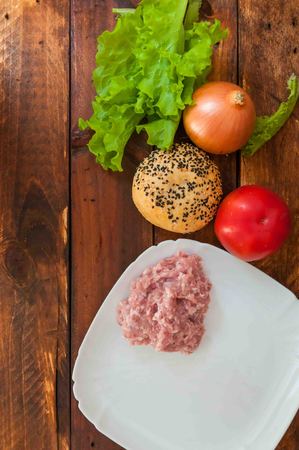 lettuce, onions, tomato and forcemeat do not table,fresh organic products,chopped meatの写真素材