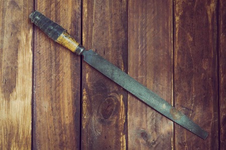 old files from the pantry. file tool for metal processing. round, flat with a wooden handleの写真素材