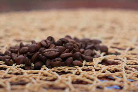 freshly roasted coffee beans on the table, the best varieties of high-end coffeeの写真素材