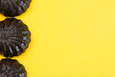 fresh chocolate marshmallows on yellow backgroundの写真素材