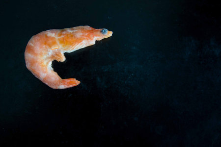 red boiled shrimp on a black background, seafoodの写真素材
