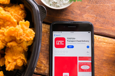 Stavropol, Russian Federation. June 10, 2019. Smartphone with mobile application TOSTOV-Transport,Food Deliveryのeditorial素材