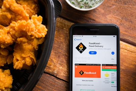 Stavropol, Russian Federation. June 10, 2019. Smartphone with mobile application FoodKood Food Deliveryのeditorial素材