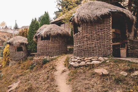 hut woven from thin branches and vines. ancient structure of ancient people. gazebo made of strawの写真素材