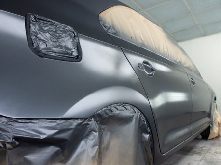 Car at the stage of painting in the workshopの写真素材