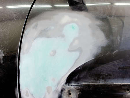 car putty during auto repairの写真素材