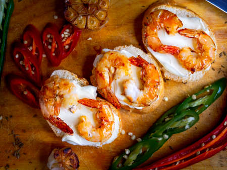 Delicious fried prawns on a skewer with sauce and lemonの写真素材