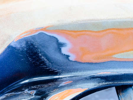 repair of paintwork on cars. car surface treated with abrasive material for further repair and body paintingの写真素材