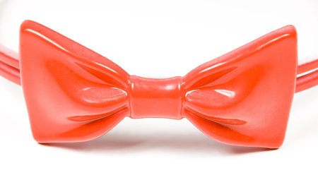 Rim for hair with red knot-butterfly on a white background