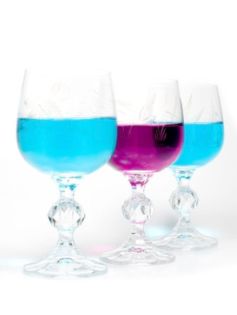 Three wineglass with drink blue and magenta colorsの写真素材