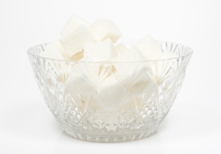 Sugar bowl with  many piece on whiteの写真素材