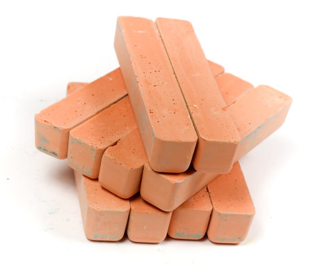 Stacked group orange chalk on white background