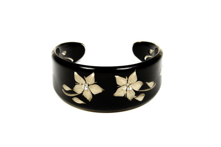 Black bracelet with decoration from flowers and gems