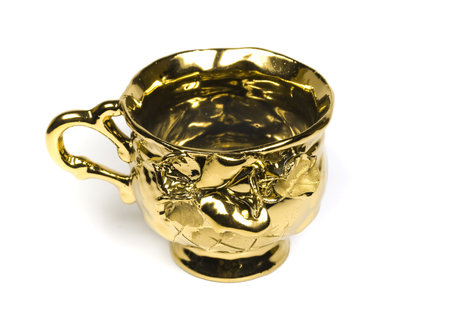 Elegant tea cup from gold with ornamentsの写真素材