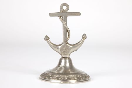 metal miniature anchor isolated on white backgroundの写真素材