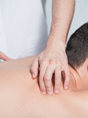 the hands of a massage that applies a massageの写真素材