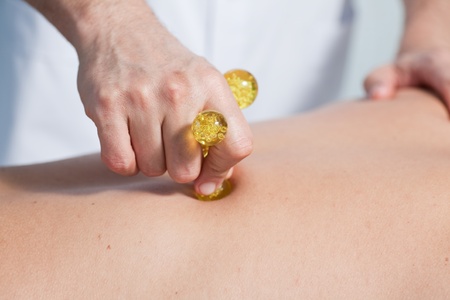the hands of a massage that applies a massageの写真素材
