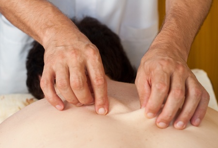 the hands of a massage that applies a massageの写真素材