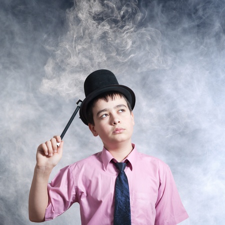 boy magician in a positionの写真素材