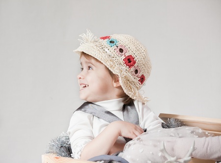 portrait of a little girl in hat on a white backgroundの写真素材