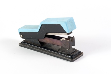 old stapler on a white background の写真素材