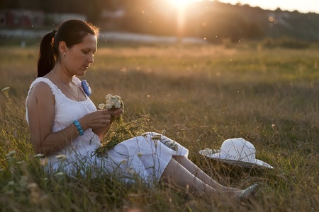 a portrait of a beautiful woman in a countrysideの写真素材