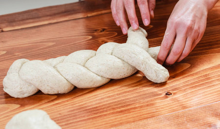 Chef preparing dough in a kitchen