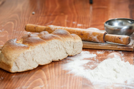 Freshly baked bread on wood tableの写真素材