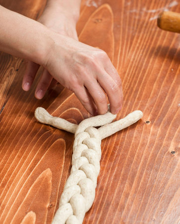 Chef preparing dough in a kitchenの写真素材