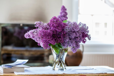 bunch lilac in vase on table