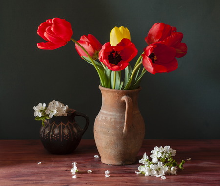still life with tulips and cherry blossomの写真素材
