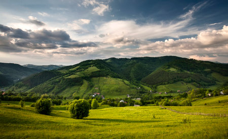 green mountain valley and blue sky with cloudsの写真素材