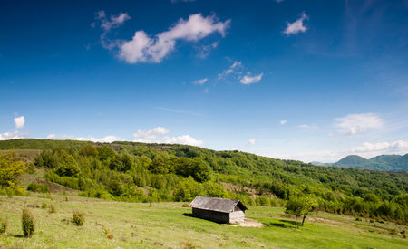 green mountain valley and blue sky with cloudsの写真素材