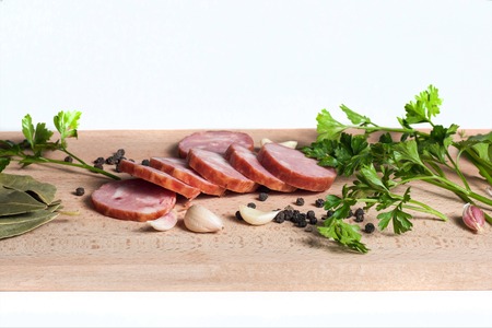 sausage on wooden table & white backgraundの写真素材