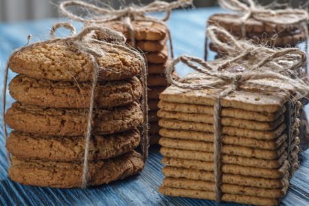 Biscuits tied with string on vintage wooden tableの写真素材