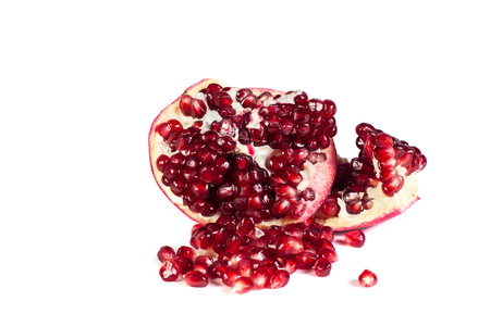 Loose pomegranates isolated on white backgroundの写真素材