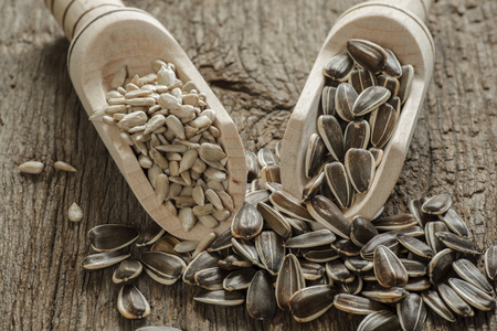 flower seeds on old wooden table, country styleの写真素材
