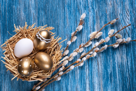 composition with colorful Easter eggs and willow bloomの写真素材